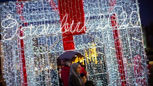 People take pictures in front of light decorations on Taksim Square during preparations to celebrate the New Year 2020 in Istanbul. (Yasin AKGUL / AFP) People take pictures in front of light decorations on Taksim Square during preparations to celebrate the New Year 2020 in Istanbul. (Yasin AKGUL / AFP)