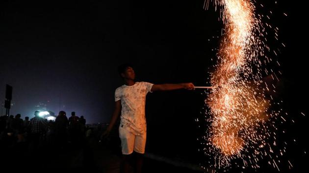 A boy lights fireworks during the New Year's celebrations in Colombo, Sri Lanka. (Dinuka Liyanawatte / REUTERS) A boy lights fireworks during the New Year's celebrations in Colombo, Sri Lanka. (Dinuka Liyanawatte / REUTERS)