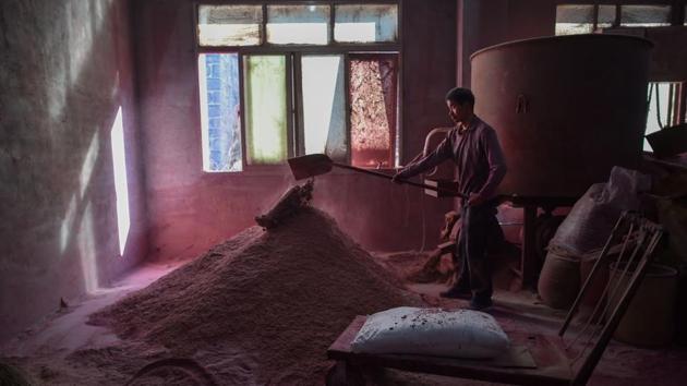 A worker shovelling powder during the preparation of incense stick production. Now, the clock is ticking with the approach of the Lunar New Year holiday later this month, when countless Chinese will pray and burn incense at temples and in traditional ceremonies. The craft of producing incense runs deep in Dapu town, where Hong Zhongsen operates a family business passed down through the generations. (Hector Retamal/AFP) A worker shovelling powder during the preparation of incense stick production. Now, the clock is ticking with the approach of the Lunar New Year holiday later this month, when countless Chinese will pray and burn incense at temples and in traditional ceremonies. The craft of producing incense runs deep in Dapu town, where Hong Zhongsen operates a family business passed down through the generations. (Hector Retamal/AFP)