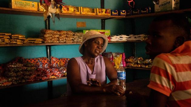 Helena Zimudzi, a shop owner serving the Mabwematema irrigation scheme community seen at the Ndaba village. The southern African country has been hit by a poor harvest and an entrenched economic crisis that has rendered basic goods out of reach for most people. “The food security situation in Zimbabwe is very dire,” said the World Food Programme (WFP) country director Eddie Rowe during a press briefing in the capital Harare. (ZINYANGE AUNTONY / AFP) Helena Zimudzi, a shop owner serving the Mabwematema irrigation scheme community seen at the Ndaba village. The southern African country has been hit by a poor harvest and an entrenched economic crisis that has rendered basic goods out of reach for most people. “The food security situation in Zimbabwe is very dire,” said the World Food Programme (WFP) country director Eddie Rowe during a press briefing in the capital Harare. (ZINYANGE AUNTONY / AFP)