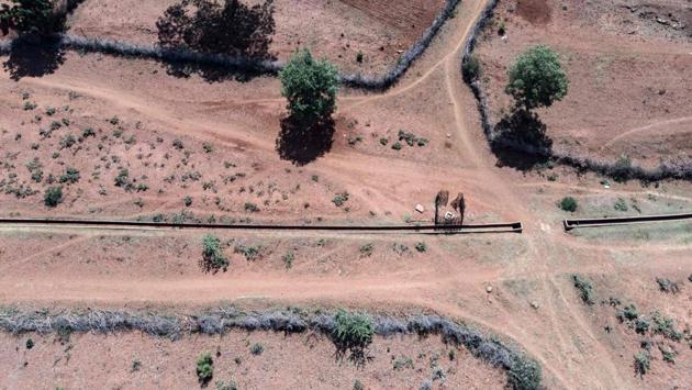 An aerial view of a dry canal seen in Zvishavane. “For the first time ever, a huge 2.2 million people will require food assistance in the urban areas.” Production of maize, a national staple, fell by 54 percent as a result of the drought, according to the MDC. The UN estimates that a total of 5.5 million people in the countryside and 2.2 million in urban areas are currently in need of help. (ZINYANGE AUNTONY / AFP) An aerial view of a dry canal seen in Zvishavane. “For the first time ever, a huge 2.2 million people will require food assistance in the urban areas.” Production of maize, a national staple, fell by 54 percent as a result of the drought, according to the MDC. The UN estimates that a total of 5.5 million people in the countryside and 2.2 million in urban areas are currently in need of help. (ZINYANGE AUNTONY / AFP)