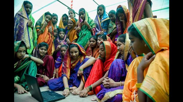 To celebrate the occasion, 189 students of the school dressed up like Savitribai Phule and presented the modern version of education by using laptops, mobiles and other gadgets that are increasingly being used for imparting knowledge. (Sanket Wankhade / HT Photo) To celebrate the occasion, 189 students of the school dressed up like Savitribai Phule and presented the modern version of education by using laptops, mobiles and other gadgets that are increasingly being used for imparting knowledge. (Sanket Wankhade / HT Photo)