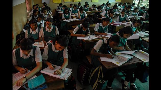 Girls are seen studying at Ahilyadevi High School for Girls. The couple had to face harassment from conservative elements. They faced ostracism; it is said that Savitribai carried a spare saree with her because people sometimes threw stones and dung at her as she walked to the school. (Sanket Wankhade / HT Photo) Girls are seen studying at Ahilyadevi High School for Girls. The couple had to face harassment from conservative elements. They faced ostracism; it is said that Savitribai carried a spare saree with her because people sometimes threw stones and dung at her as she walked to the school. (Sanket Wankhade / HT Photo)