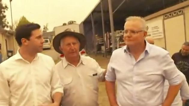 This still image taken from video provided by AuBC, Australian Prime Minister Scott Morrison is confronted by angry residents as he visited a wildfire-ravaged Cobargo, in New South Wales on Thursday, Jan. 2, 2020. The outpouring of anger came as authorities said 381 homes had been destroyed on the New South Wales southern coast this week. More than 200 fires are burning in Australia's two most-populous states.(AP)