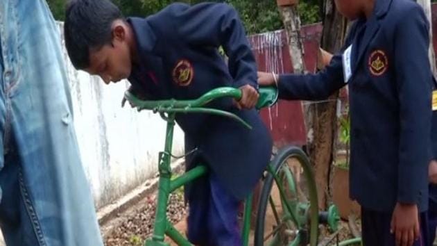 A student uses peddle powered water pump in the school. (ANI) A student uses peddle powered water pump in the school. (ANI)