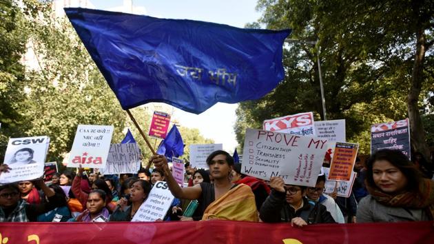 People hold placards and flags during a protest by the LGBTQ community against the Citizenship Amendment Act (CAA), at Jantar Mantar in New Delhi. (Amal KS / HT Photo)