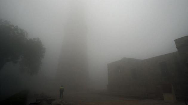 A view of the Qutub Minar engulfed in dense fog on a cold winter morning, at Mehrauli in New Delhi. The India Meteorology Department (IMD) confirmed that December 30 was the coldest day of the month in Delhi since 1901, with the maximum temperature recorded at just 9.4 degrees Celsius. (Amal KS / HT Photo)