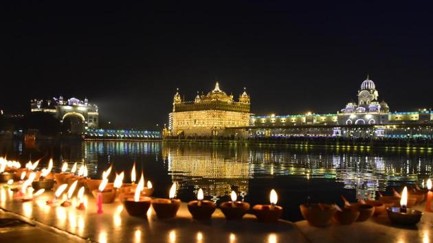 A view of the Golden Temple illuminated on the occasion of the 353rd birth anniversary of Guru Gobind Singh, in Amritsar. (Sameer Sehgal / HT Photo)