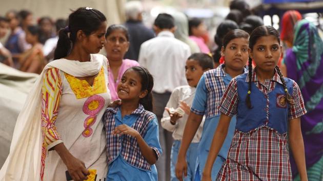 Students and parents leave after attending a mega Parent Teacher Meet)(Sanchit Khanna/HT PHOTO)