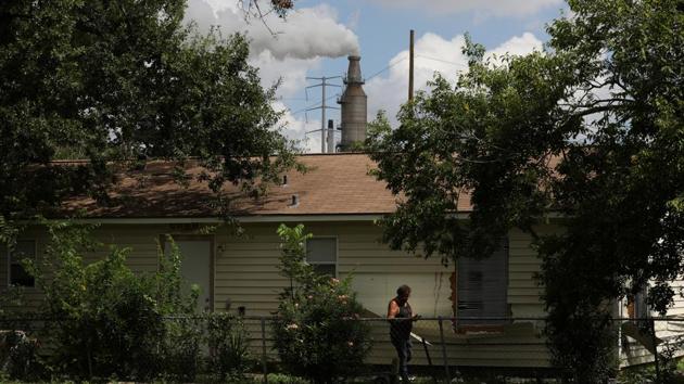 The Fernando family moves out of their home in the Manchester neighbourhood of Houston, Texas. They were bought out by Valero Energy Corp as the refinery planed to expand operations. On the east side of Houston, the white plumes of the Texas oil and chemical refineries are a constant backdrop for residents of this neighbourhood. (Loren Elliott / REUTERS)