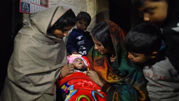 Nagrikta, a Pakistani Hindu child born in India who got her birth certificate recently, is seen with her family members at Majnu ka Tilla, in New Delhi. (Sanchit Khanna / HT Photo)