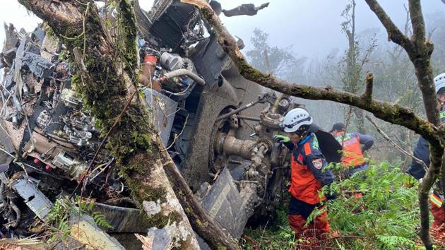 A rescue team searches for missing military officers, after a Black Hawk helicopter made a forced landing at a mountainous area near Taipei. The chief of the general staff, Shen Yi-ming, was among eight senior officers -- including three major-generals -- who died when their helicopter smashed into mountains. (Yilan County Fire Bureau via REUTERS) A rescue team searches for missing military officers, after a Black Hawk helicopter made a forced landing at a mountainous area near Taipei. The chief of the general staff, Shen Yi-ming, was among eight senior officers -- including three major-generals -- who died when their helicopter smashed into mountains. (Yilan County Fire Bureau via REUTERS)