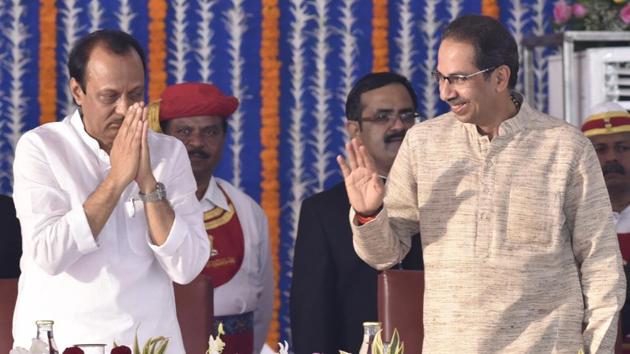 Deputy chief minister of Maharashtra Ajit Pawar gestures at chief minister Uddhav Thackarey during the swearing in ceremony, at Vidhan Bhavan in Mumbai. (Anshuman Poyrekar / HT Photo)