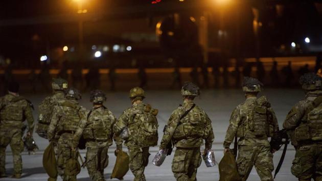 In this photo, U.S. Army soldiers from the 82nd Airborne board a C-17 aircraft at Fort Bragg, N.C., to be deployed to the Middle East. In addition to these troops, the United States is sending nearly 3,000 more soldiers to the Mideast as reinforcements in the volatile aftermath of the killing of Iranian Gen. Qassem Soleimani, defense officials said Friday, Jan. 3.(AP)