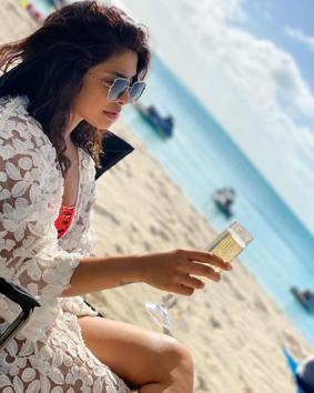 Priyanka Chopra Jonas also headed for a beachy vacation with husband and musician Nick Jonas and some friends, she looked uber cool as she sipped some bubbly at the beach in an orange-red swimsuit and a white overlay. Total Baywatch vibes. (INSTAGRAM)