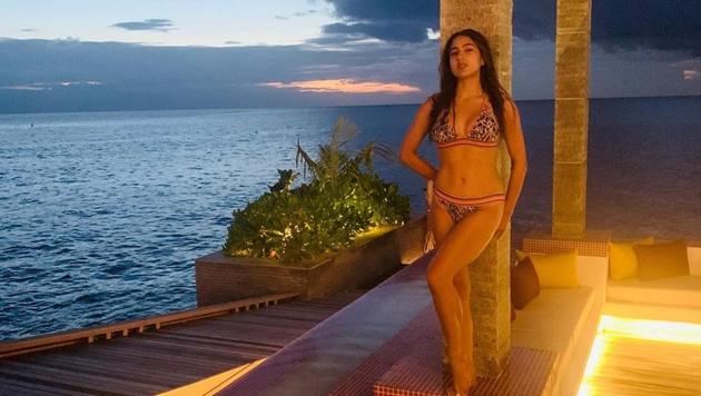 Sara Ali Khan spent her New Year soaking up the sun and catching some waves with brother Ibrahim and mother Amrita Singh in the Maldives. (instagram)
