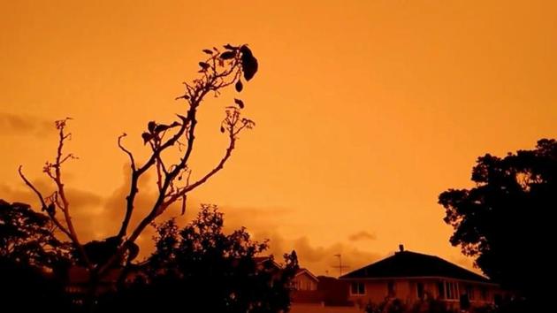 A view of orange skies in Auckland, New Zealand, from smoke plumes caused by bushfires in Australia. (REUTERS) A view of orange skies in Auckland, New Zealand, from smoke plumes caused by bushfires in Australia. (REUTERS)
