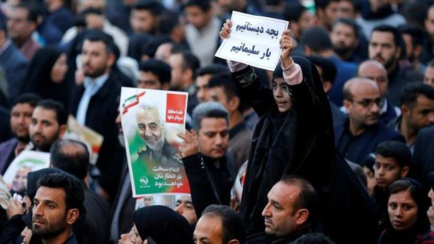 A girl holds a sign during a funeral procession for Iranian Major-General Qassem Soleimani, head of the elite Quds Force, and Iraqi militia commander Abu Mahdi al-Muhandis, who were killed in an air strike at Baghdad airport, in Ahvaz, Iran. (Photo: Reuters) A girl holds a sign during a funeral procession for Iranian Major-General Qassem Soleimani, head of the elite Quds Force, and Iraqi militia commander Abu Mahdi al-Muhandis, who were killed in an air strike at Baghdad airport, in Ahvaz, Iran. (Photo: Reuters)