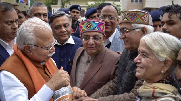 Haryana chief minister Manohar Lal Khattar campaigns door-to-door during the launch of Jan Jagran Abhiyan under the Citizenship Amendment Act Act in Jalandhar on Sunday.(PTI)