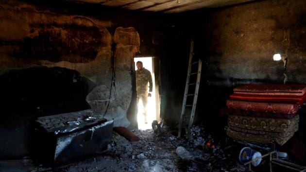 A fighter loyal to Libya's U.N.-backed government (GNA) looks at a room burned during clashes with troops loyal to Khalifa Hiftar in Wadi Rabiya neighbourhood at outskirts of Tripoli, Libya. (REUTERS) A fighter loyal to Libya's U.N.-backed government (GNA) looks at a room burned during clashes with troops loyal to Khalifa Hiftar in Wadi Rabiya neighbourhood at outskirts of Tripoli, Libya. (REUTERS)