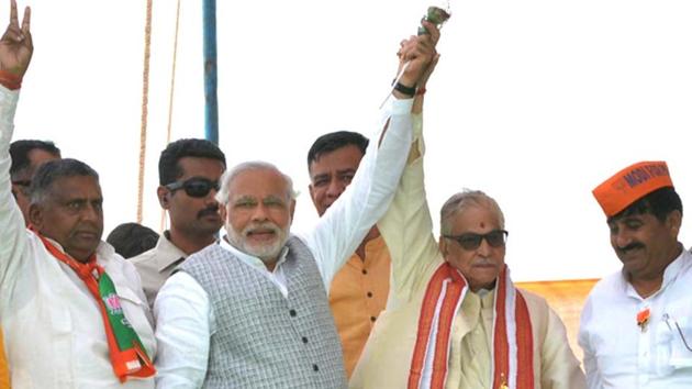 Narendra-Modi-middle-with-Akbarpur-candidate-Devendra-Singh-Bhole-left-and-Murli-Manohar-Joshi-right-during-a-rally-in-Kanpur-HT-photo-Amit-Singh-Yadav (HT Photo/AS Yadav) Narendra-Modi-middle-with-Akbarpur-candidate-Devendra-Singh-Bhole-left-and-Murli-Manohar-Joshi-right-during-a-rally-in-Kanpur-HT-photo-Amit-Singh-Yadav (HT Photo/AS Yadav)