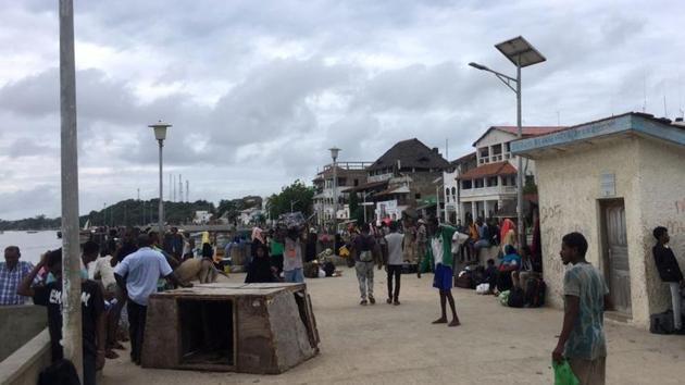 Travellers are seen gathered at the Lamu jetty following an attack by Somalia’s Islamist group al Shabaab on a military base in Manda, Lamu(REUTERS)