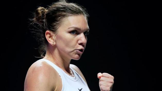 Romania's Simona Halep reacts during her group stage match against Czech Republic's Karolina Pliskova.(REUTERS)