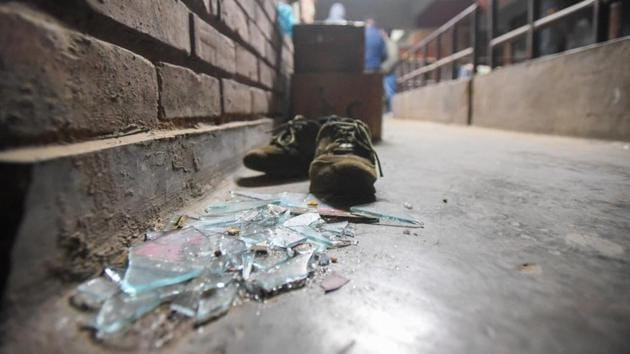 Videos and television visuals showed the mob with strips of cloth covering their faces, vandalise hostels, hurl stones and hit students with sticks on the JNU campus in Delhi on Sunday. (Amal KS/HT Photo) Videos and television visuals showed the mob with strips of cloth covering their faces, vandalise hostels, hurl stones and hit students with sticks on the JNU campus in Delhi on Sunday. (Amal KS/HT Photo)