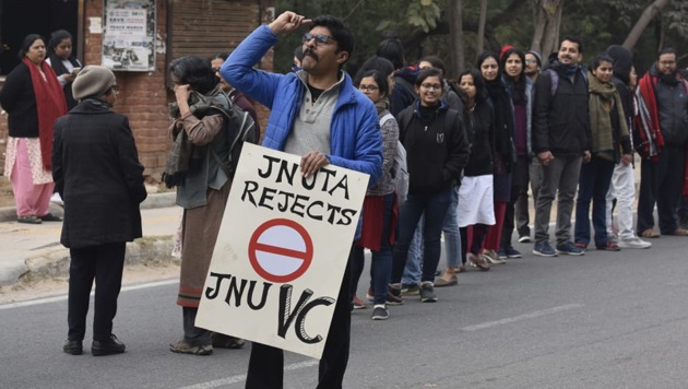A protestor is seen on the campus in front of the human chain made by JNUTA at the gate of JNU campus against the violence on students. (Photo: Vipin Kumar/ Hindustan Times) A protestor is seen on the campus in front of the human chain made by JNUTA at the gate of JNU campus against the violence on students. (Photo: Vipin Kumar/ Hindustan Times)