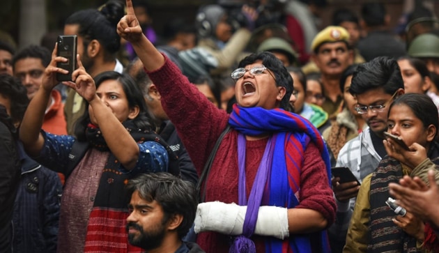 JNU students; union members shout slogans at the gate of the university during a protest against the Sunday night’s attack.(Vipin Kumar/HT Photo)