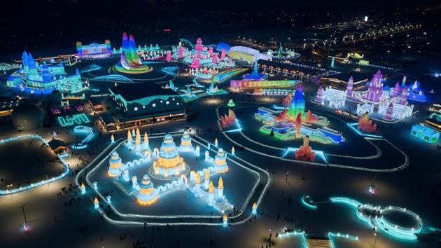 An aerial view shows ice sculptures illuminated at the Harbin Ice and Snow World festival in Harbin. China expects 340 million people to visit snow and ice attractions in the 2021-2022 winter season, up from 224 million in the 2018-2019 season, Xinhua reported. (Noel Celis/AFP) An aerial view shows ice sculptures illuminated at the Harbin Ice and Snow World festival in Harbin. China expects 340 million people to visit snow and ice attractions in the 2021-2022 winter season, up from 224 million in the 2018-2019 season, Xinhua reported. (Noel Celis/AFP)