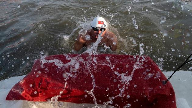 A swimmer participates in the winter swimming competition ahead of the opening of the Harbin International Snow and Sculpture Festival in Harbin. (Noel Celis/AFP) A swimmer participates in the winter swimming competition ahead of the opening of the Harbin International Snow and Sculpture Festival in Harbin. (Noel Celis/AFP)
