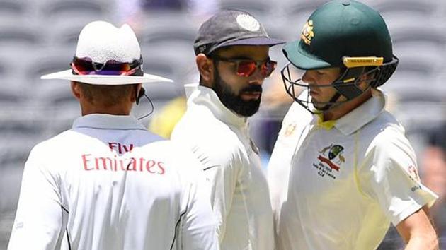 India's captain Virat Kohli (C) and Australia's captain Tim Paine. (REUTERS) India's captain Virat Kohli (C) and Australia's captain Tim Paine. (REUTERS)