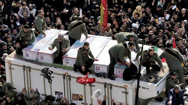 Coffins of General Qassem Soleimani and others who were killed in Iraq by a US drone strike, are carried on a truck surrounded by mourners during a funeral procession. (AP Photo) Coffins of General Qassem Soleimani and others who were killed in Iraq by a US drone strike, are carried on a truck surrounded by mourners during a funeral procession. (AP Photo)