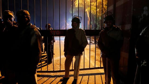 Police in riot gear stand guard. Deputy commissioner of police (southwest) Devender Arya claimed that a flag march was conducted and the campus was normal but late in the night students and teachers claimed the situation remained tense. As news spread of the violence, political parties and leaders condemned the violence and traded charges. (Adnan Abidi/REUTERS) Police in riot gear stand guard. Deputy commissioner of police (southwest) Devender Arya claimed that a flag march was conducted and the campus was normal but late in the night students and teachers claimed the situation remained tense. As news spread of the violence, political parties and leaders condemned the violence and traded charges. (Adnan Abidi/REUTERS)