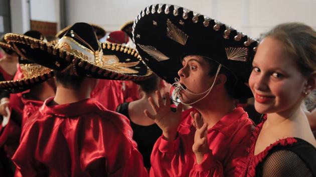 A boy with Down syndrome plays with the strings of his hat in the changing room during a dance show. “Spending even a little time together with them will make anyone change their views,” Bucur said. Being born with either a mental or physical disability in pre-1989 Romania was almost a sentence. The unluckiest ones were surrendered to state care immediately after birth, which usually meant a lifetime inside institutions. (Vadim Ghirda/AP) A boy with Down syndrome plays with the strings of his hat in the changing room during a dance show. “Spending even a little time together with them will make anyone change their views,” Bucur said. Being born with either a mental or physical disability in pre-1989 Romania was almost a sentence. The unluckiest ones were surrendered to state care immediately after birth, which usually meant a lifetime inside institutions. (Vadim Ghirda/AP)