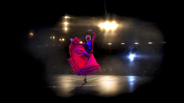 A ballerina of the Arabesque Children’s Ballet Ensemble, seen through a hole in the stage curtains performs during a show featuring children with Down syndrome. The two-hour show featured ethnic and classical dances, with children and adults wearing traditional Romanian folk costumes. (Andreea Alexandru/AP) A ballerina of the Arabesque Children’s Ballet Ensemble, seen through a hole in the stage curtains performs during a show featuring children with Down syndrome. The two-hour show featured ethnic and classical dances, with children and adults wearing traditional Romanian folk costumes. (Andreea Alexandru/AP)