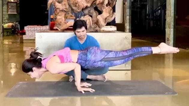 Shilpa Shetty performs Mayurasana in the presence of her trailer.