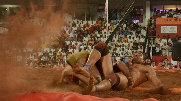 Shailesh Shelke from Latur (red band) in action during the 63rd Maharashtra Kesari wrestling championship at Shiv Chhatrapati sports complex, Balewadi on Monday. (MILIND SAURKAR/HT) Shailesh Shelke from Latur (red band) in action during the 63rd Maharashtra Kesari wrestling championship at Shiv Chhatrapati sports complex, Balewadi on Monday. (MILIND SAURKAR/HT)