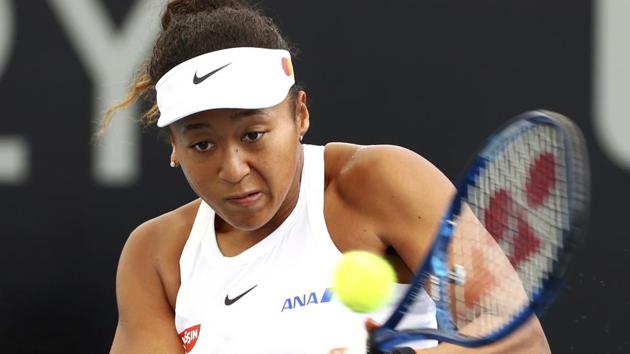 Naomi Osaka of Japan plays a shot during her match against Maria Sakkari of Greece.(AP)