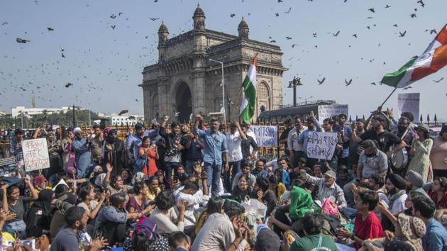 People raise slogans during the protest on Monday afternoon. According to a statement issued by JNU’s administration, prior to the violence on Sunday, there had been unrest on campus because some students opposed a proposed fee hike. (Pratik Chorge / HT Photo) People raise slogans during the protest on Monday afternoon. According to a statement issued by JNU’s administration, prior to the violence on Sunday, there had been unrest on campus because some students opposed a proposed fee hike. (Pratik Chorge / HT Photo)