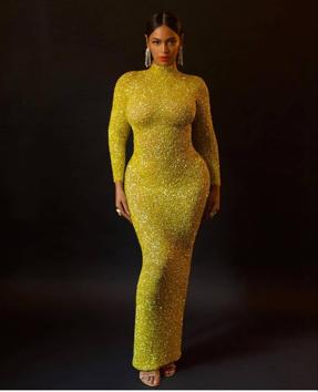 While Beyonce’s yellow gown did not have the asymmetrical train but instead was just a full-length straight gown, the look was still great. (instagram) While Beyonce’s yellow gown did not have the asymmetrical train but instead was just a full-length straight gown, the look was still great. (instagram)