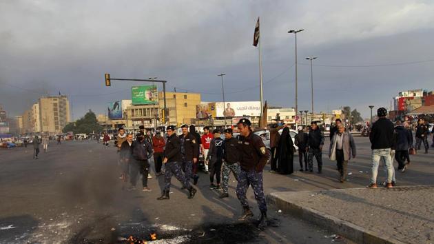 Protesters during a protest against the Iranian missile strike in Baghdad, Iraq.(AP Photo)