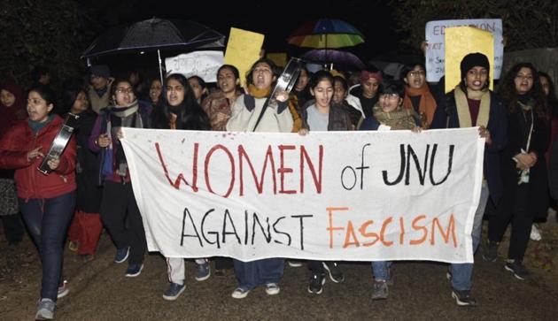 People hold placards during a protest march in solidarity with JNU students against Sunday’s violence, at JNU campus, in New Delhi, India, on Tuesday, January 7, 2020.(Photo: Burhaan Kinu / Hindustan Times)