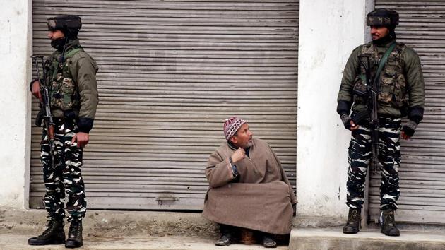 An old man sit as security personnel stands guard near encounter site in Awantipora Pulwama district of south Kashmir on Tuesday. (ANI file photo) An old man sit as security personnel stands guard near encounter site in Awantipora Pulwama district of south Kashmir on Tuesday. (ANI file photo)