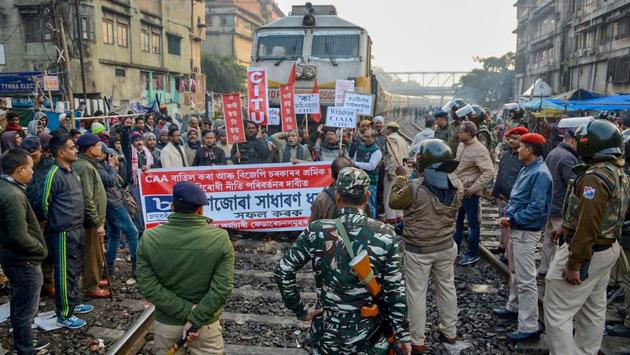 Members of Centre of Indian Trade Union (CITU) block the Trivandrum Express during the strike in Guwahati. Normal life was hit in Assam as vehicles remained off the roads and markets were shut due to the strike against “anti- people” policies of the Centre, PTI reported. Most banks also remained close across the state. (PTI)