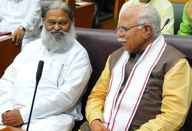 Haryana home minister Anil Vij with chief minister Manohar Lal Khattar (right) during a recent assembly session. A controversy erupted when the official website of the state assembly cited the chief minister as holding the charge of the criminal investigation department, the intelligence arm of the state government. (HT file photo) Haryana home minister Anil Vij with chief minister Manohar Lal Khattar (right) during a recent assembly session. A controversy erupted when the official website of the state assembly cited the chief minister as holding the charge of the criminal investigation department, the intelligence arm of the state government. (HT file photo)