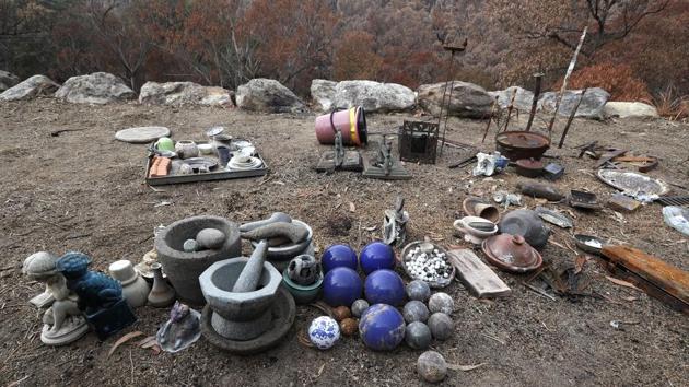Objects found in the rubble of the home are laid out after the fire. “We had our plan in place, but still, it spanked us like little naughty children,” Justin said. “That’s Mother Nature for you.” (Rick Rycroft / AP) Objects found in the rubble of the home are laid out after the fire. “We had our plan in place, but still, it spanked us like little naughty children,” Justin said. “That’s Mother Nature for you.” (Rick Rycroft / AP)