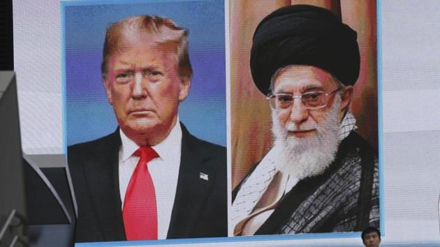 A man walks by a huge screen showing U.S. President Donald Trump, left, and Iranian Supreme Leader Ayatollah Ali Khamenei, in Tokyo. (AP) A man walks by a huge screen showing U.S. President Donald Trump, left, and Iranian Supreme Leader Ayatollah Ali Khamenei, in Tokyo. (AP)