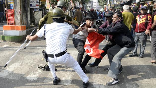 Left Front party activists clash with police personnel during a nationwide strike called by trade unions in Kolkata on Wednesday. (ANI Photo) Left Front party activists clash with police personnel during a nationwide strike called by trade unions in Kolkata on Wednesday. (ANI Photo)